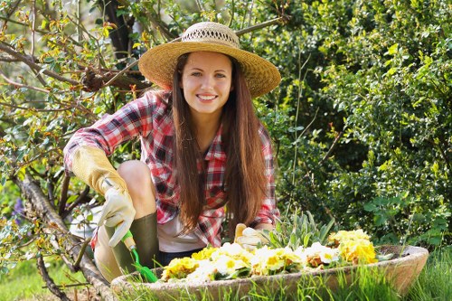 Gardener reviewing a service issue in a garden setting