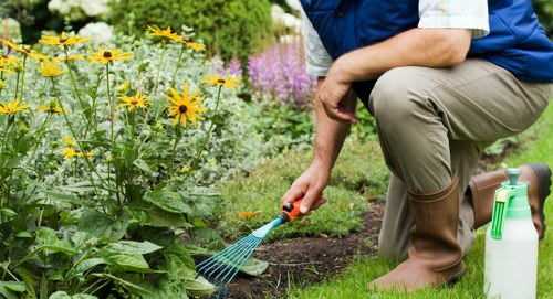 Gardening team following safe working practices during outdoor tasks